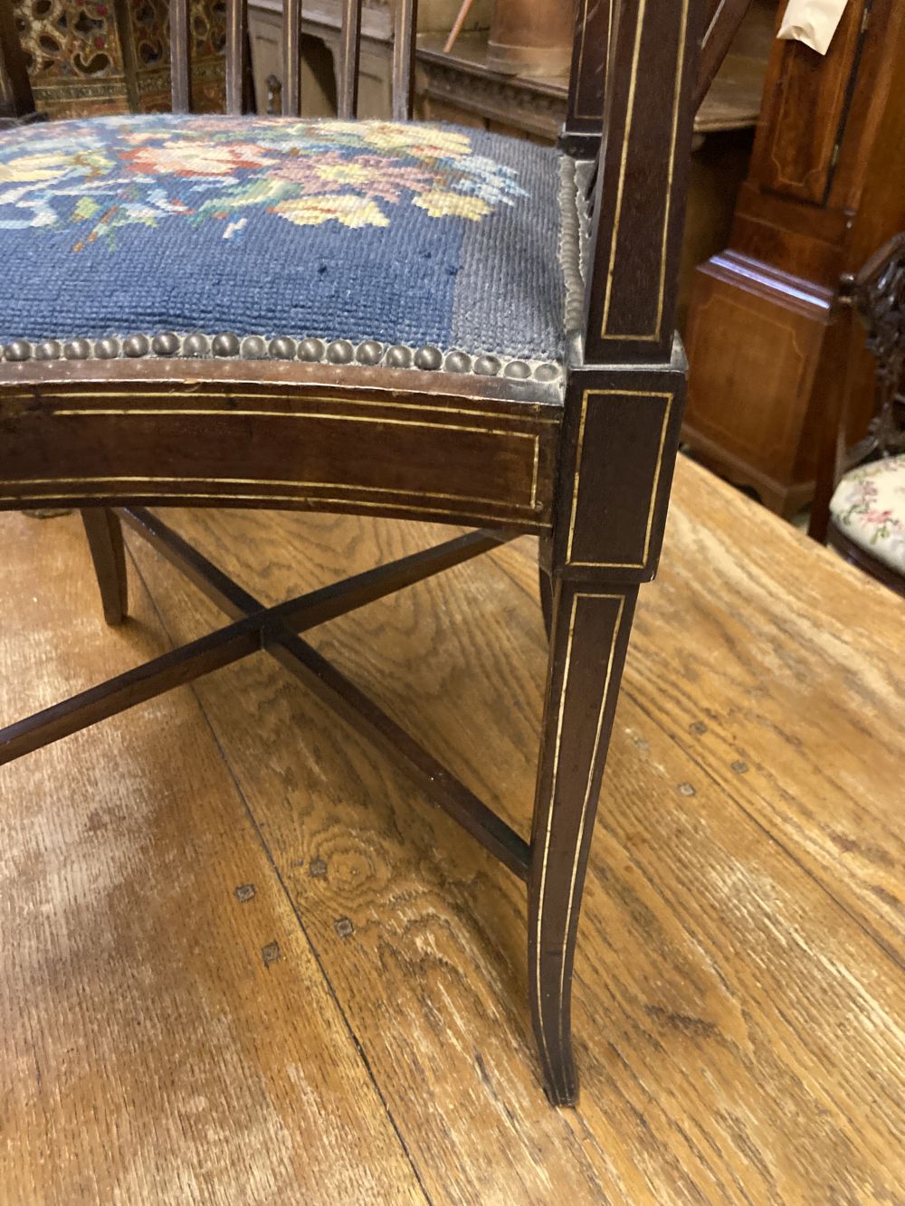 A Victorian inlaid mahogany corner elbow chair